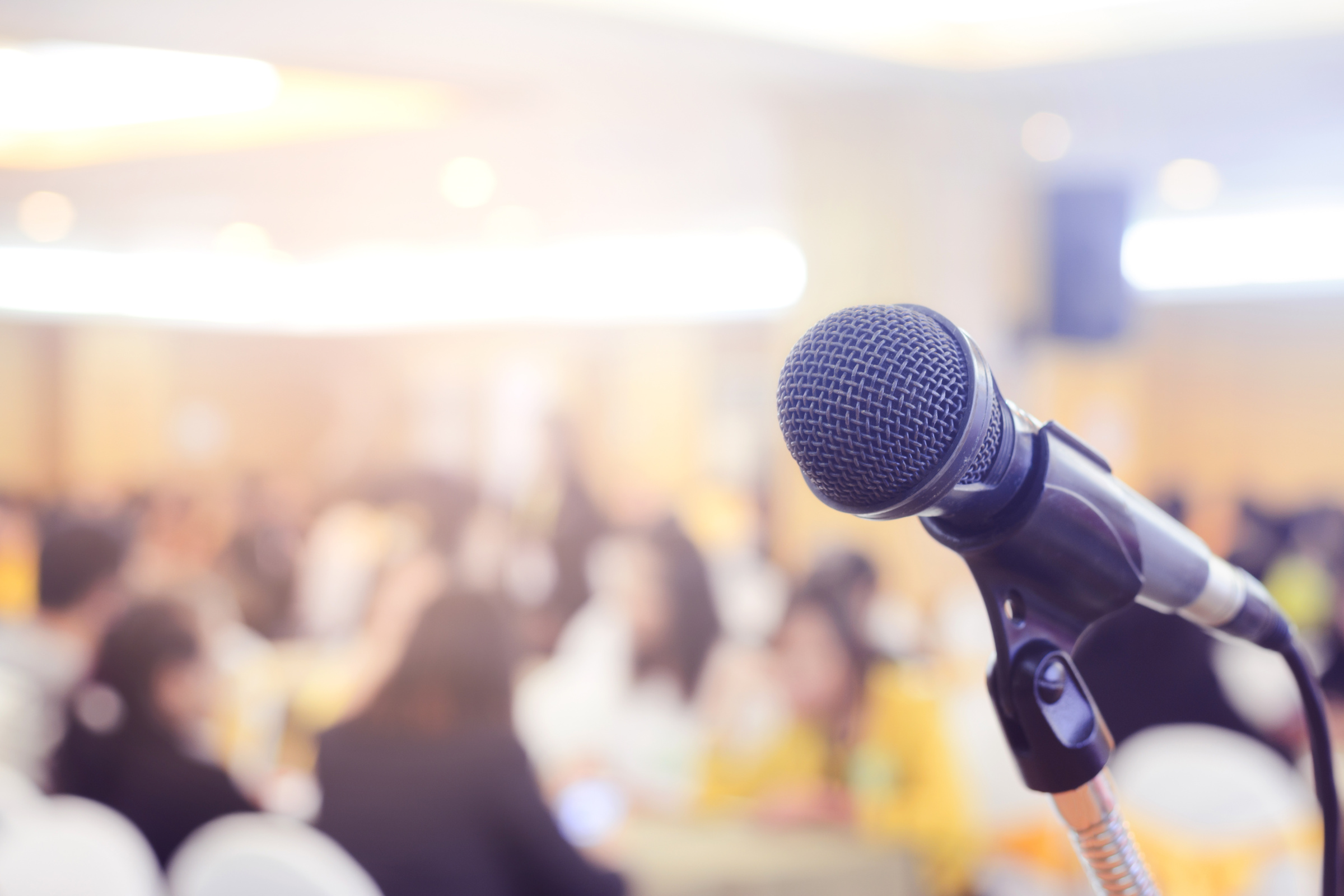 Microphone in conference on seminar room event background